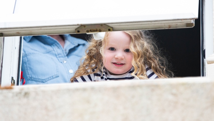 Families exchanging food bank donations for portraits